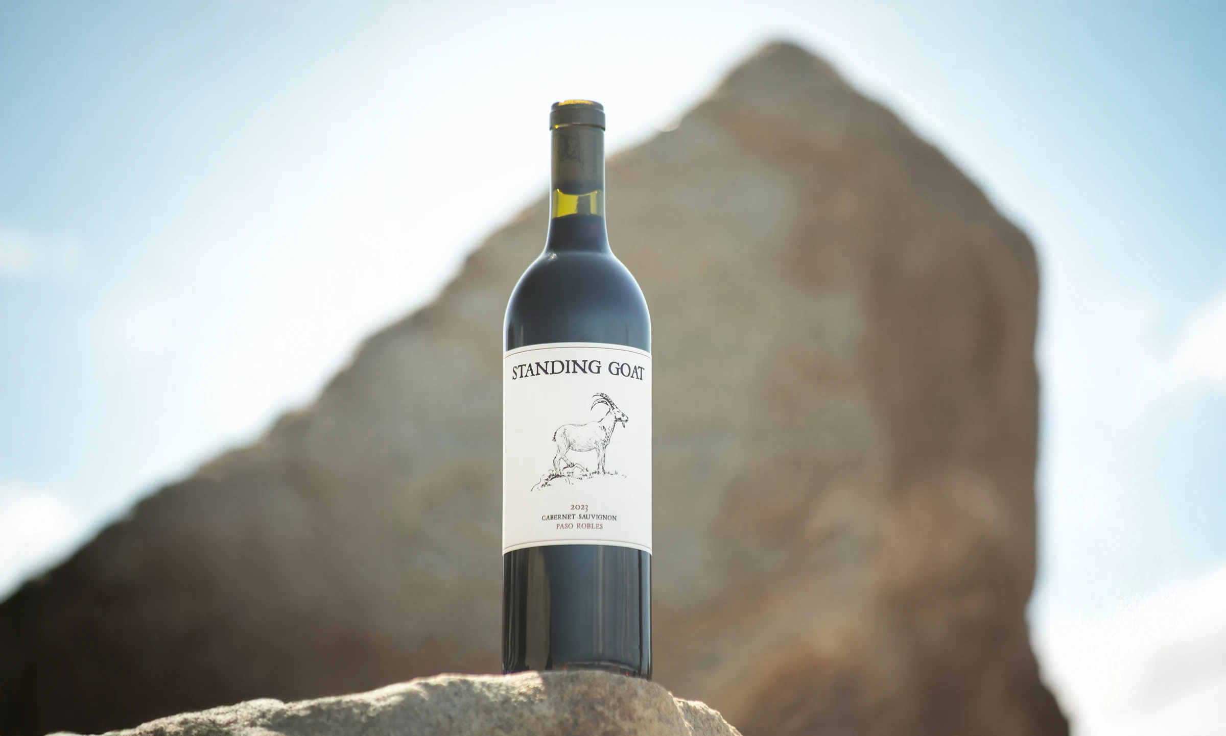 Standing Goat Cabernet Sauvignon among sunlit sandstone rocks